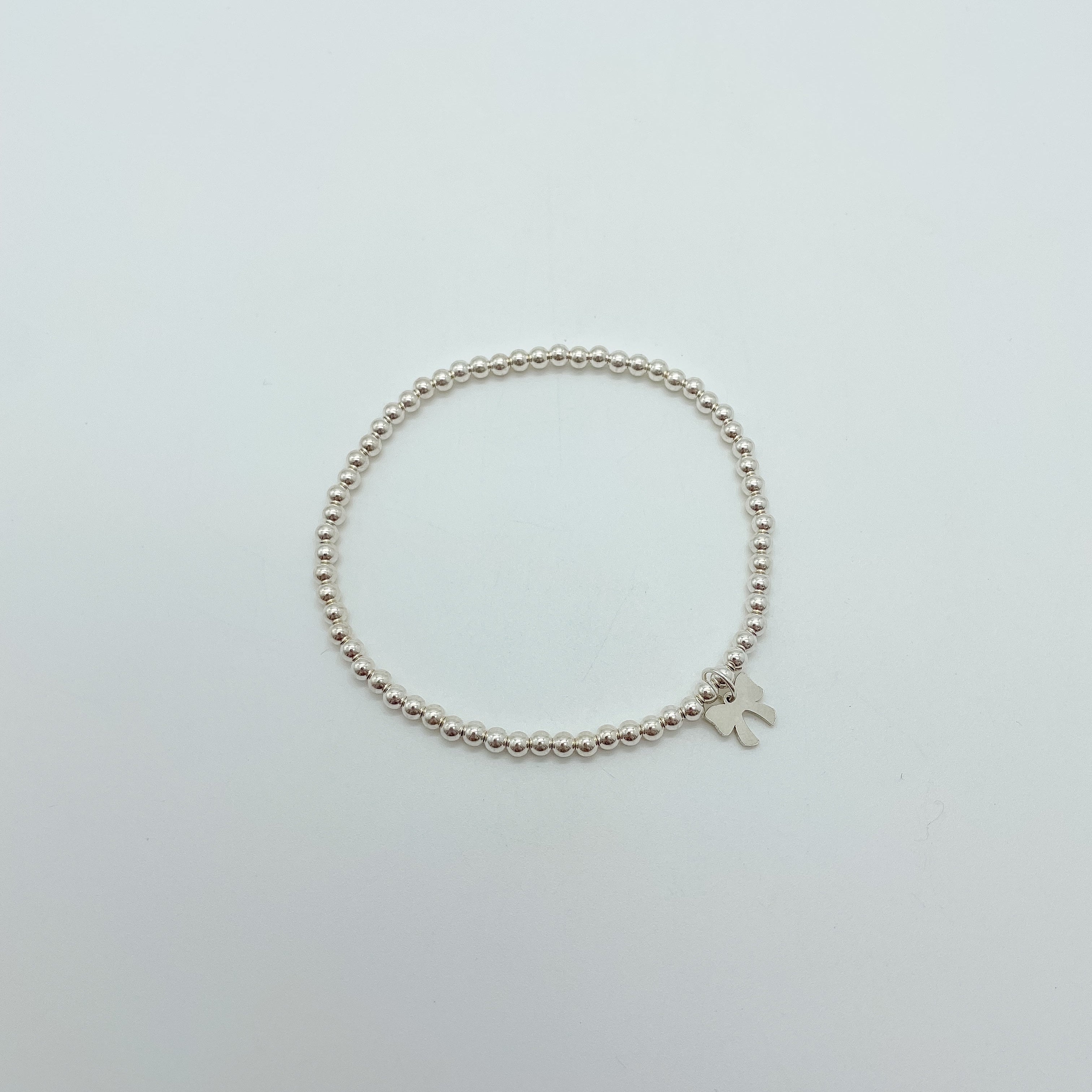 emma beaded bracelet, gold-filled beaded bracelet, sterling silver beaded bracelet, elastic bracelet, handmade, small business, 5mm beaded bracelet, 4mm beaded bracelet, 3mm beaded bracelet, 2mm beaded bracelet, trendy bracelet, best seller, gifts for her, everyday jewelry, bow jewelry