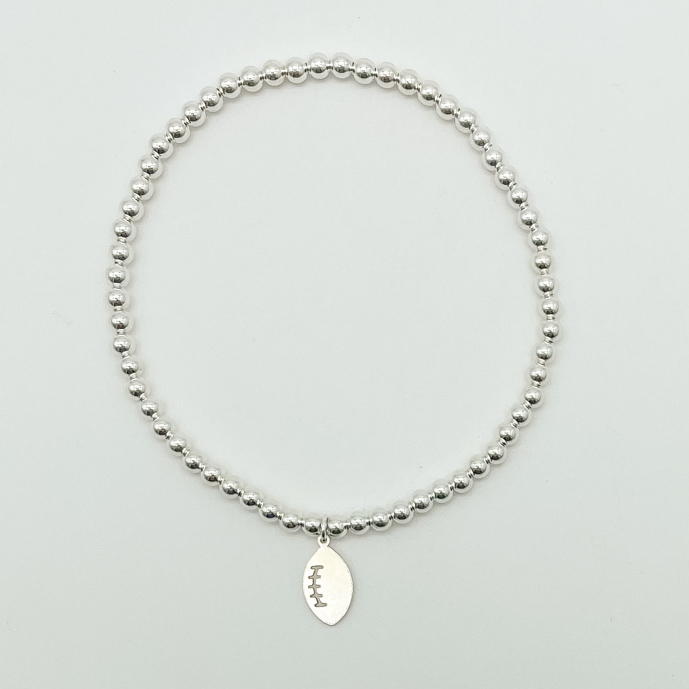 Football charm bracelet, Football accessories, small business, sterling silver, waterproof jewelry, beaded bracelet, elastic bracelet, charm bracelet, handmade, Michigan made, essbe, football season, braceket stack inspo