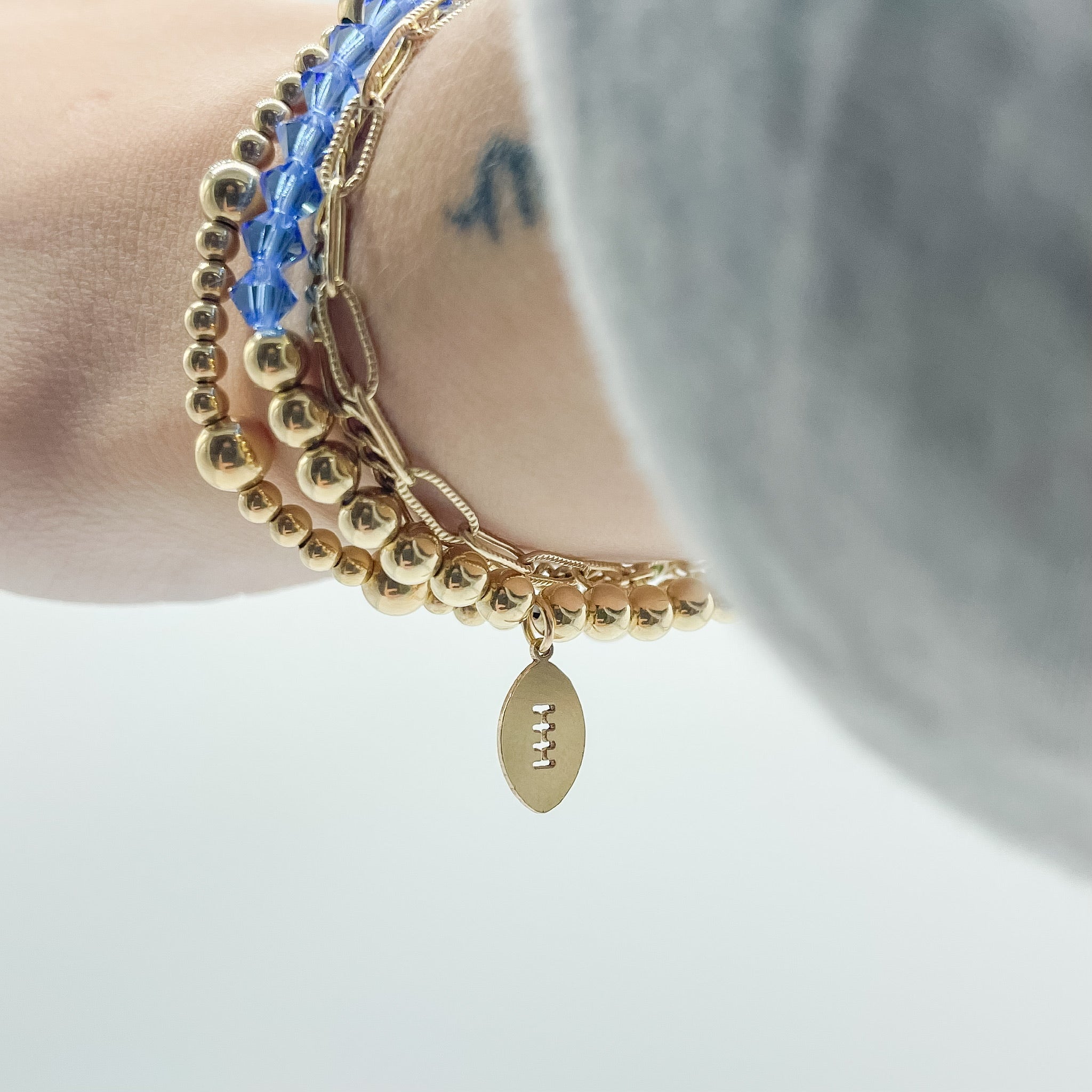 Lions bracelet, Detroit Lions accessory, small business, handmade, Michigan made, Essbe, Detroit beaded bracelet, Detroit bracelet, Blue bracelet, beaded bracelet, elastic bracelet, precioso beads, 14k gold-filled beads, football charm bracelet, football bracelet, howlite beaded bracelet, howlite beads, waterproof bracelet, bracelet stack inspo