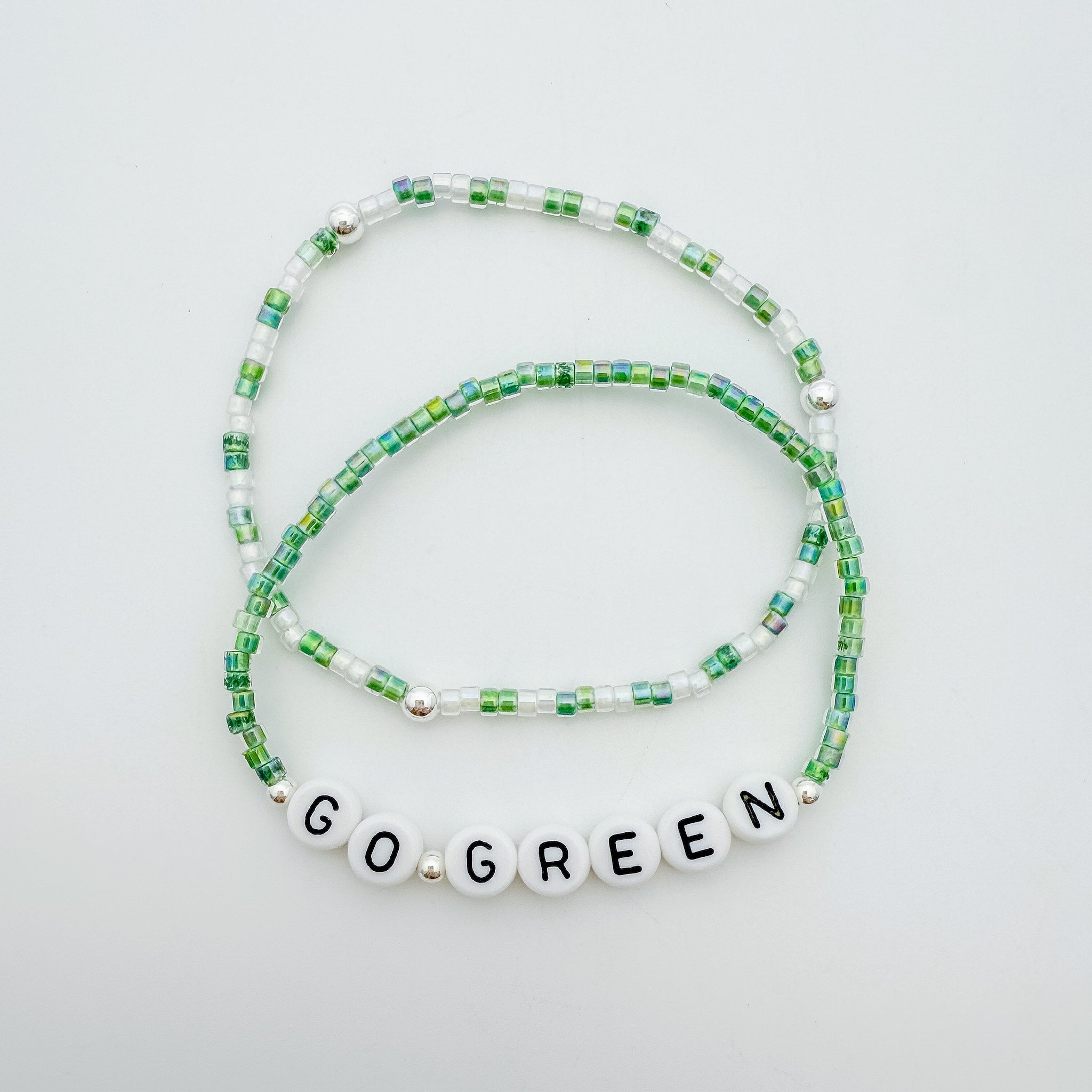 Michigan State accessories, MSU accessories, Green and white accessory, handmade, MSU bracelet, small business, Michigan made, Football jewelry, Game day jewelry, elastic bracelet, 14k gold-filled, waterproof jewelry, .925 sterling silver jewelry, game day jewelry, go green jewelry, bracelet stack, colorful bracelets