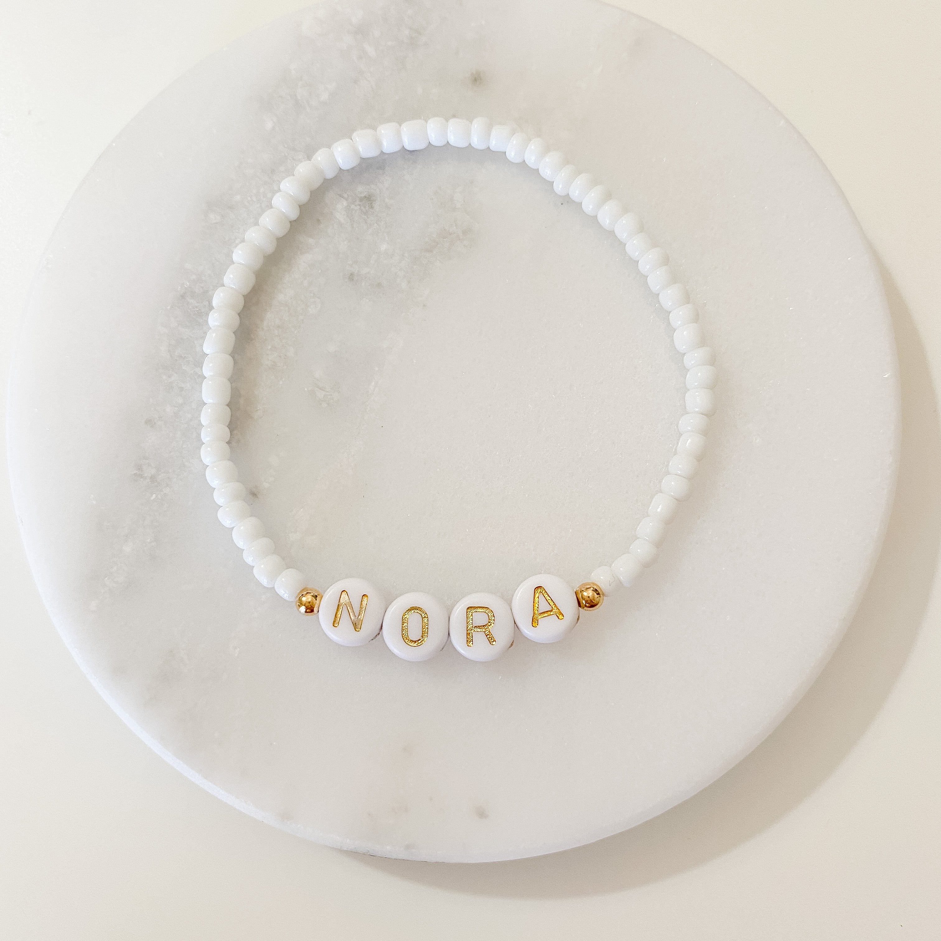 Personalized bracelets, elastic bracelets, beaded bracelet, gold-filled bracelet, dainty bracelet, handmade, essbe, small business, name bracelet, letter bead bracelets