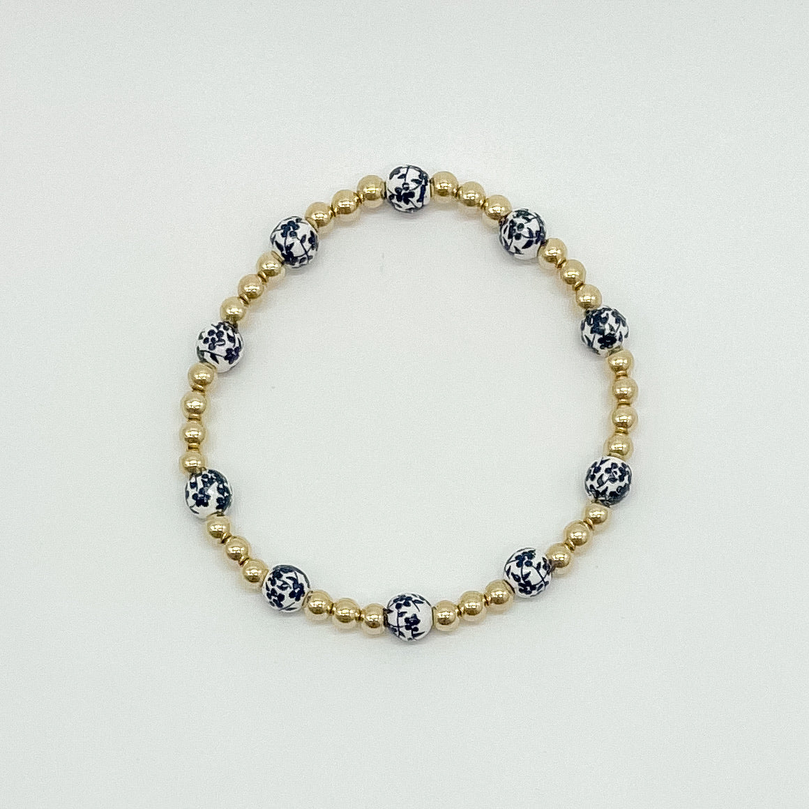 floral bracelet, beaded bracelet, elastic bracelet, statement bracelet, 14k gold filled bracelet, fall collection, fall accessories, stackable jewelry, dainty jewelry, essbe, small business, handmade, michigan made, black porcelain looking bracelet beads