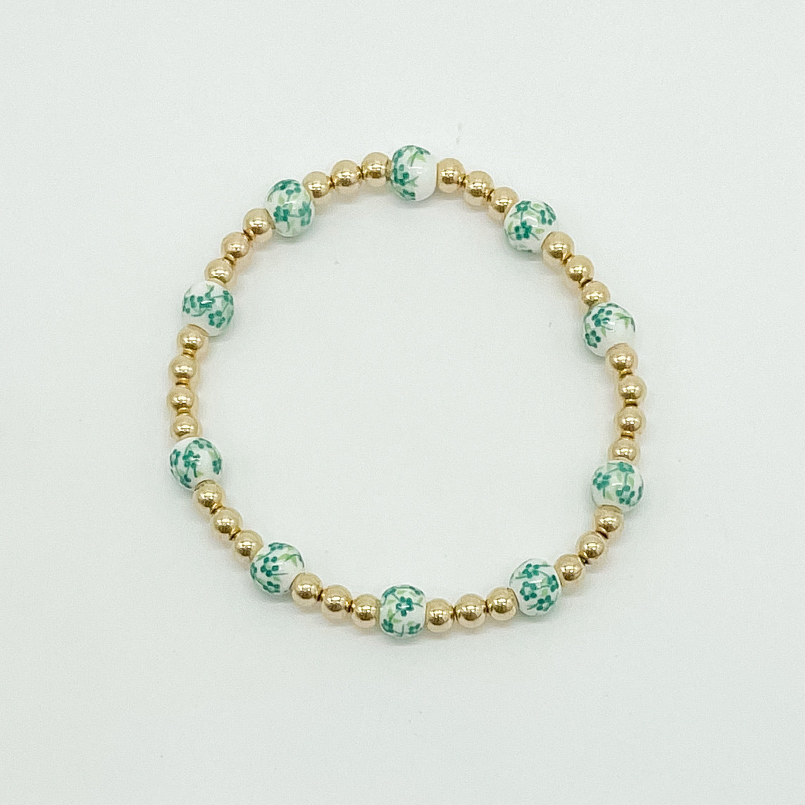 floral bracelet, beaded bracelet, elastic bracelet, statement bracelet, 14k gold filled bracelet, fall collection, fall accessories, stackable jewelry, dainty jewelry, essbe, small business, handmade, michigan made, green porcelain looking bracelet beads