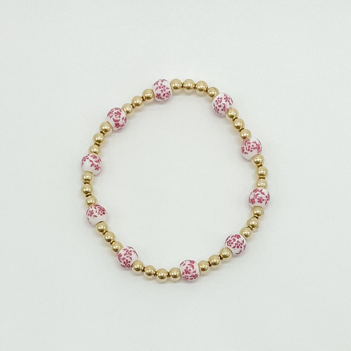 floral bracelet, beaded bracelet, elastic bracelet, statement bracelet, 14k gold filled bracelet, fall collection, fall accessories, stackable jewelry, dainty jewelry, essbe, small business, handmade, michigan made, pink porcelain looking bracelet beads, pink floral bracelet