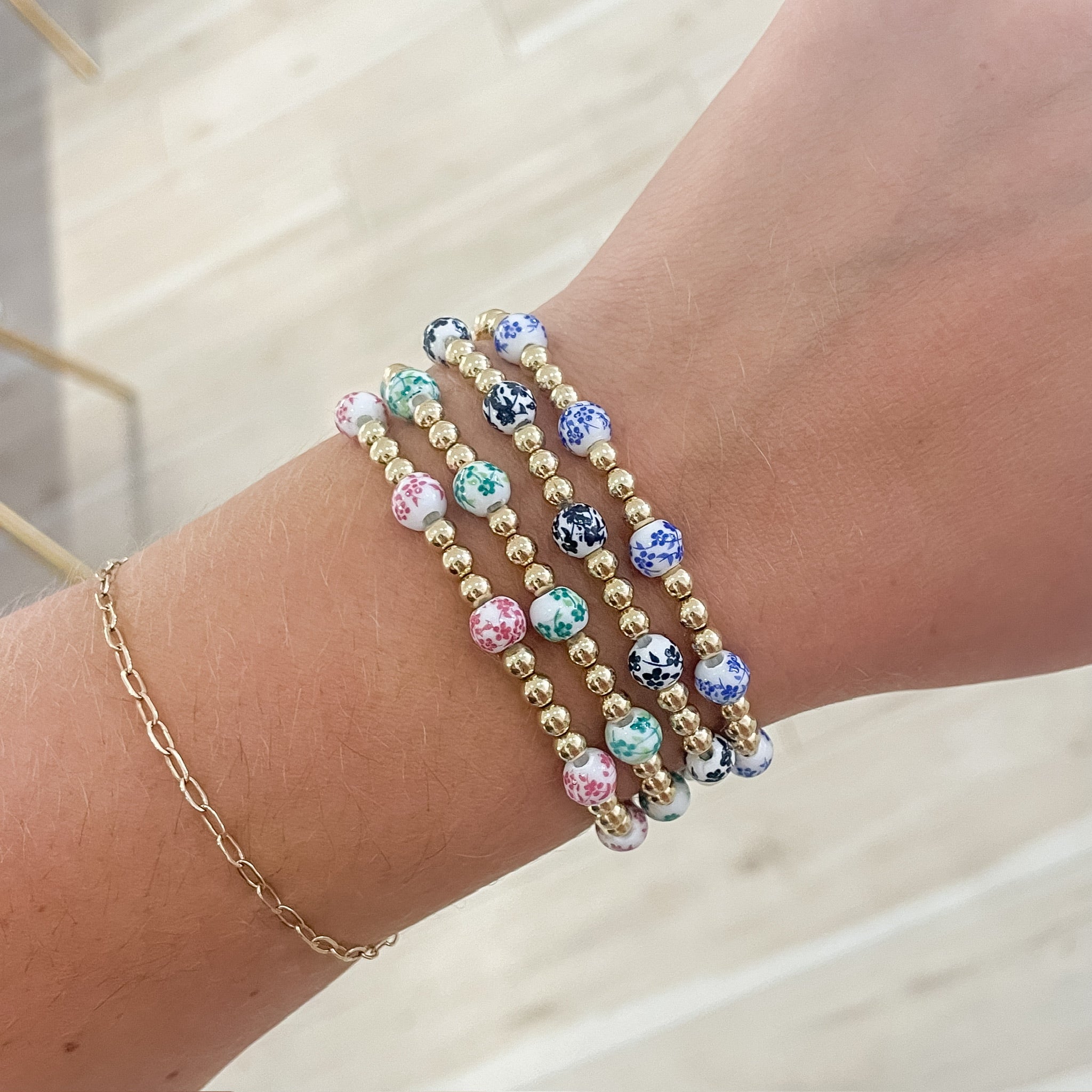 floral bracelet, beaded bracelet, elastic bracelet, statement bracelet, 14k gold filled bracelet, fall collection, fall accessories, stackable jewelry, dainty jewelry, essbe, small business, handmade, michigan made, porcelain looking bracelet beads, fall bracelet inspo, callie beaded bracelet