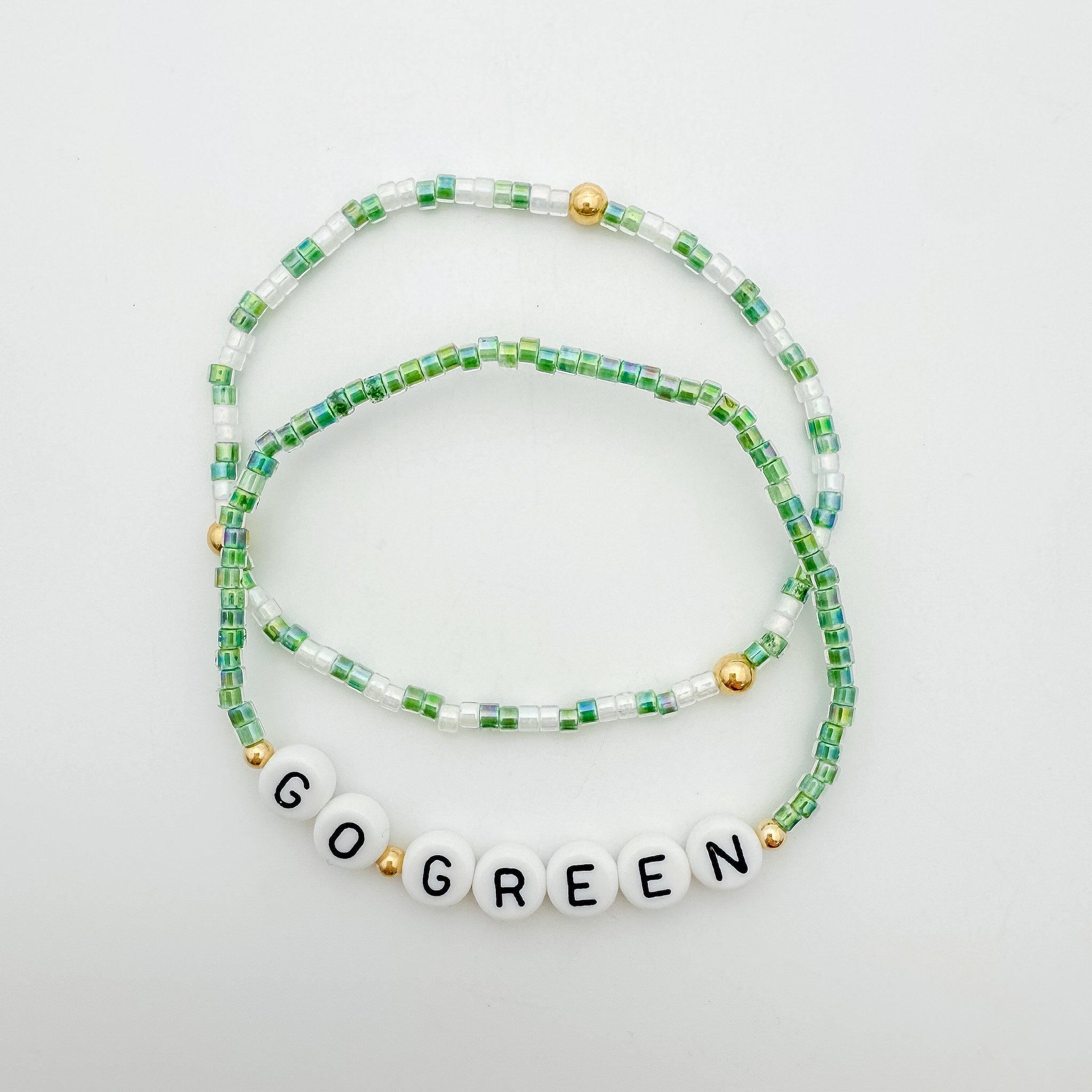 Michigan State accessories, MSU accessories, Green and white accessory, handmade, MSU bracelet, small business, Michigan made, Football jewelry, Game day jewelry, elastic bracelet, 14k gold-filled, waterproof jewelry, .925 sterling silver jewelry, game day jewelry, go green jewelry, bracelet stack, colorful bracelets