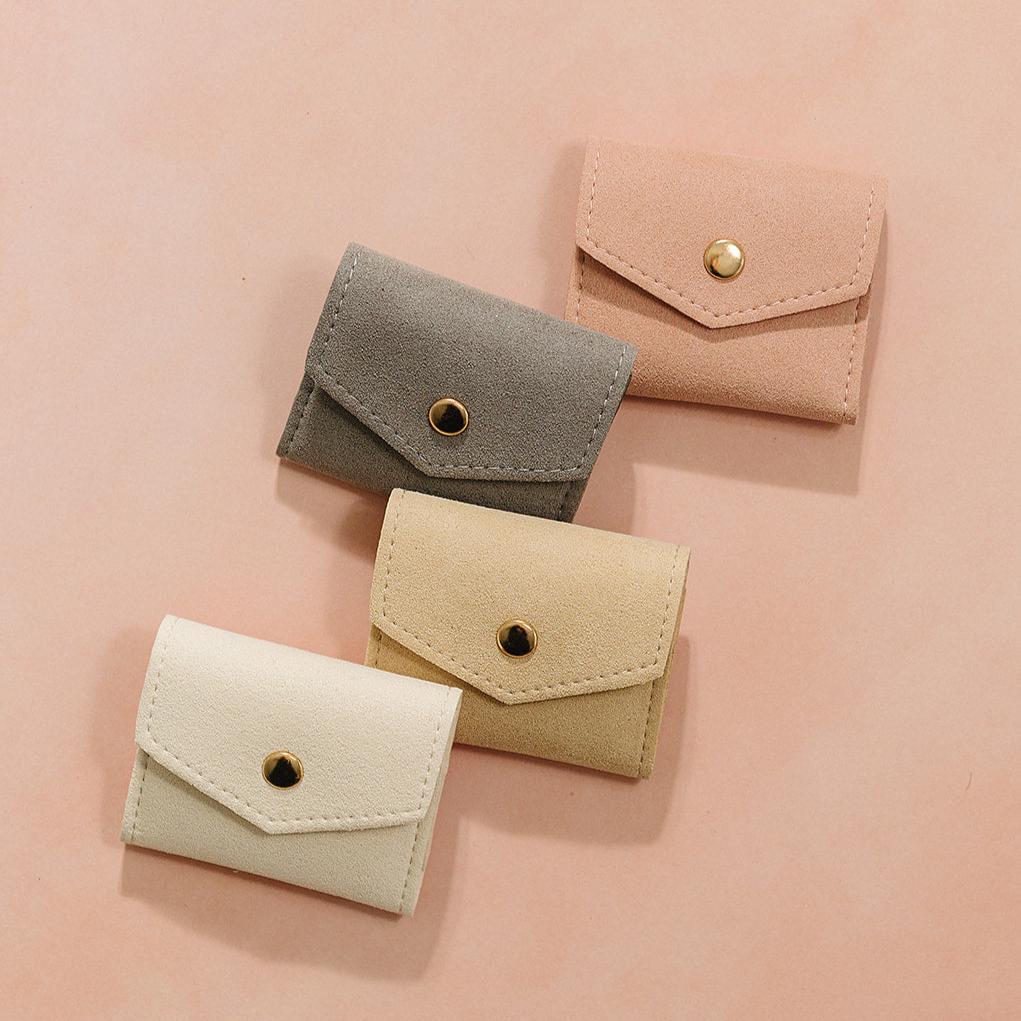 mini jewelry pouch, jewelry storage, essbe, small business, beige pouch, small jewelry pouch, everyday jewelry holder, on the go jewelry holder, jewelry pouch, white jewelry storage, tan white jewelry pouch, grey jewelry pouch, pink jewelry pouch