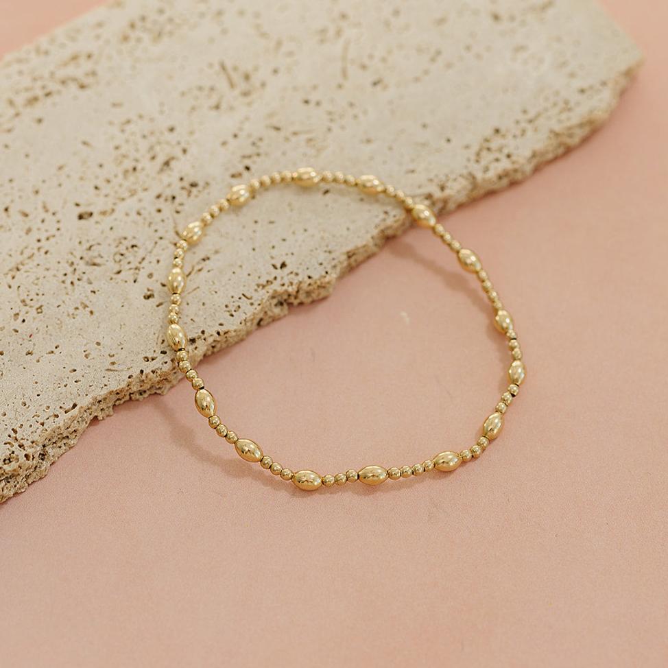 Penelope beaded bracelet, 14k gold filled bracelet, elastic bracelet, beaded bracelet, 2mm round beads, 5mm oval beads, oval beaded bracelet, elegant bracelet, small business, handmade, fall collection, michigan made, stackable bracelet