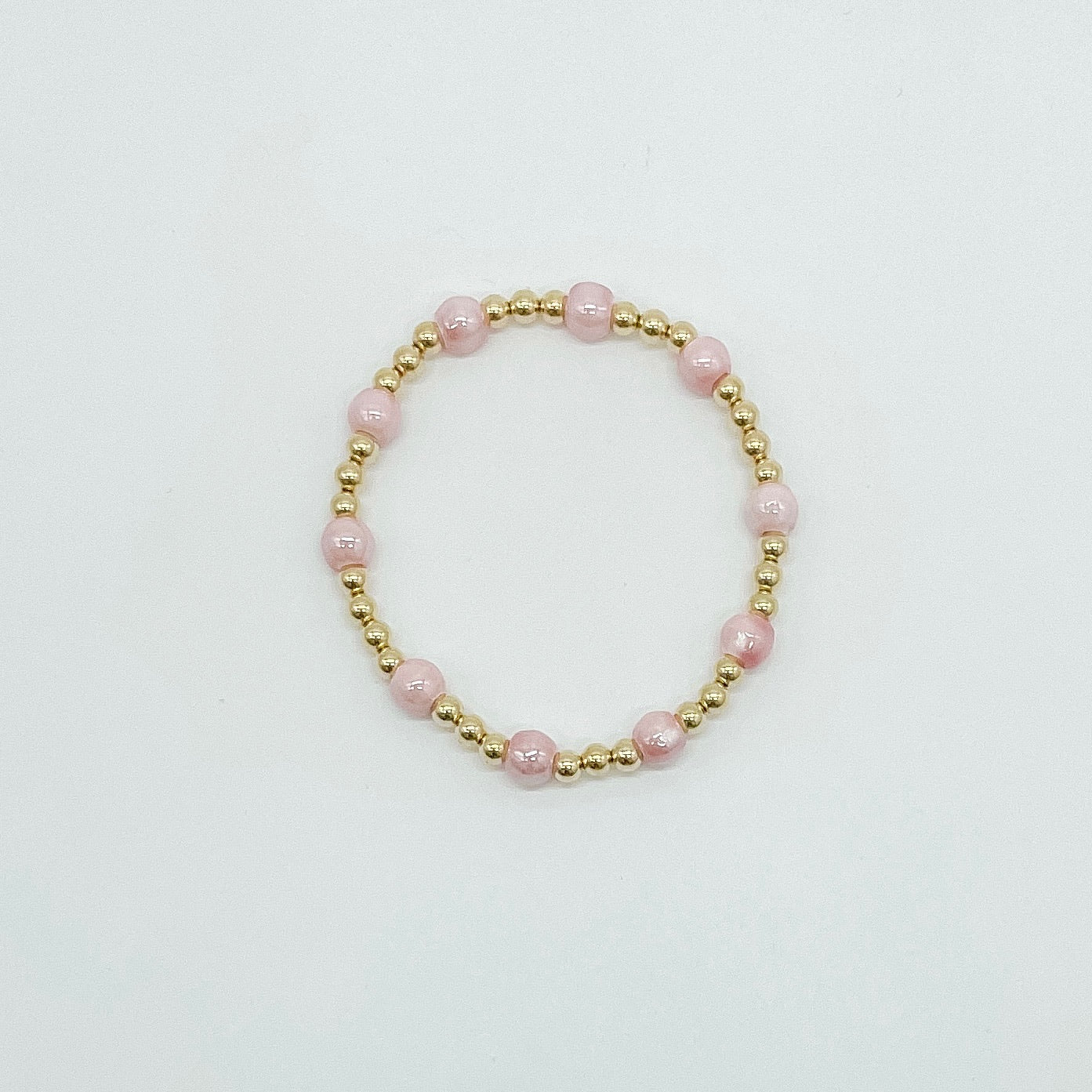 Sabrina beaded bracelet, pink beaded bracelet, pink and gold bracelet, beaded bracelet, elastic bracelet, stackable bracelet, handmade, small business, 14k gold filled spacer beads, 5mm pink beads, michigan made, fall collection