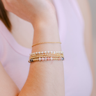 gold filled beaded bracelet stack inspiration, Seeded beaded bracelet, white, made in michigan, gold-filled bracelet, small business, essbe, handmade, dainty jewelry, stackable jewelry, elastic bracelet, beaded bracelet, gold-filled bracelet