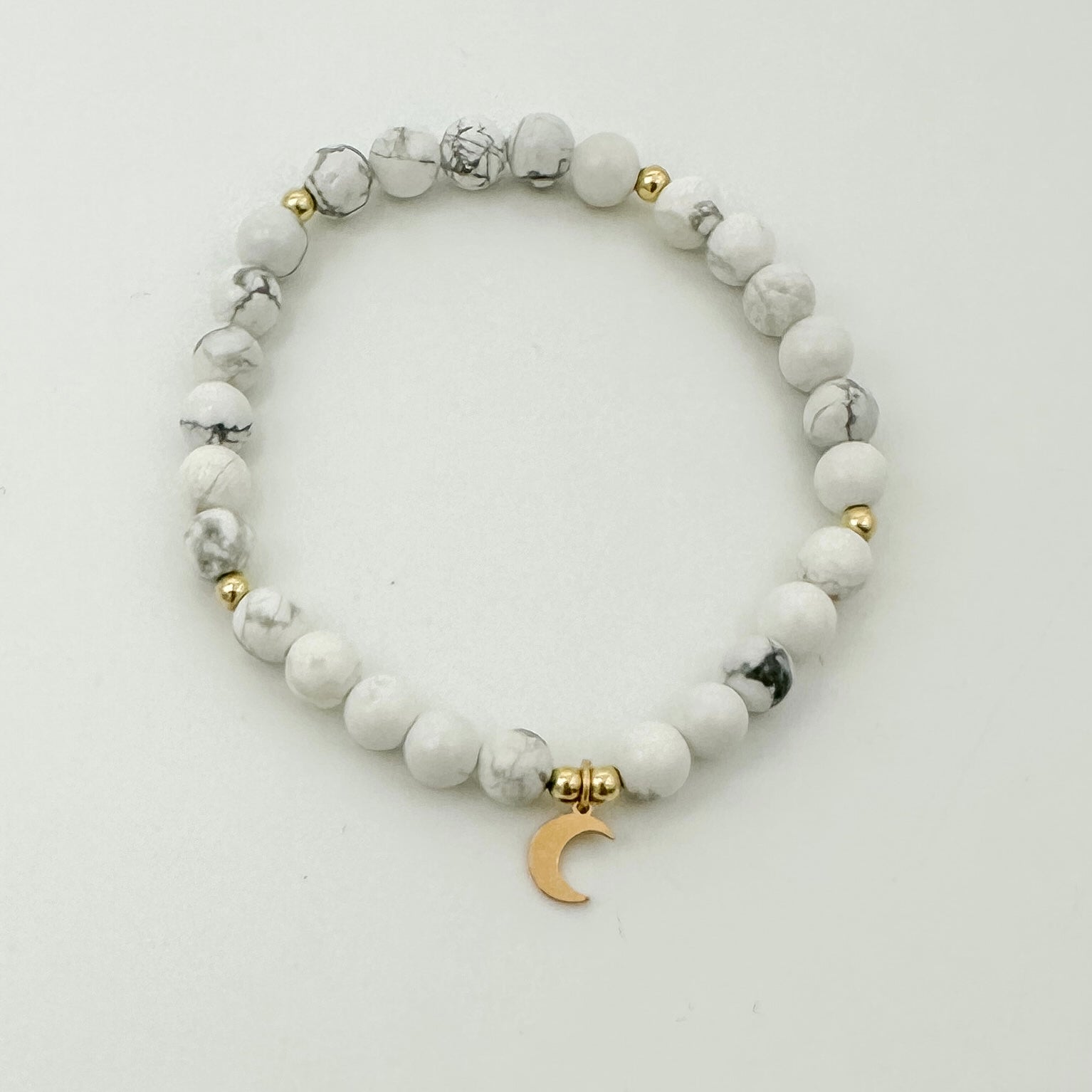 Paige bracelet, howlite beads, small business, handmade, dainty bracelet, stackable bracelet, gold filled spacer beads, moon charm, elastic bracelet, stretchy bracelet, michigan made, essbe