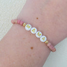 Personalized bracelets, elastic bracelets, beaded bracelet, gold-filled bracelet, dainty bracelet, handmade, essbe, small business, name bracelet, letter bead bracelets, pink bracelet, pink beaded bracelet