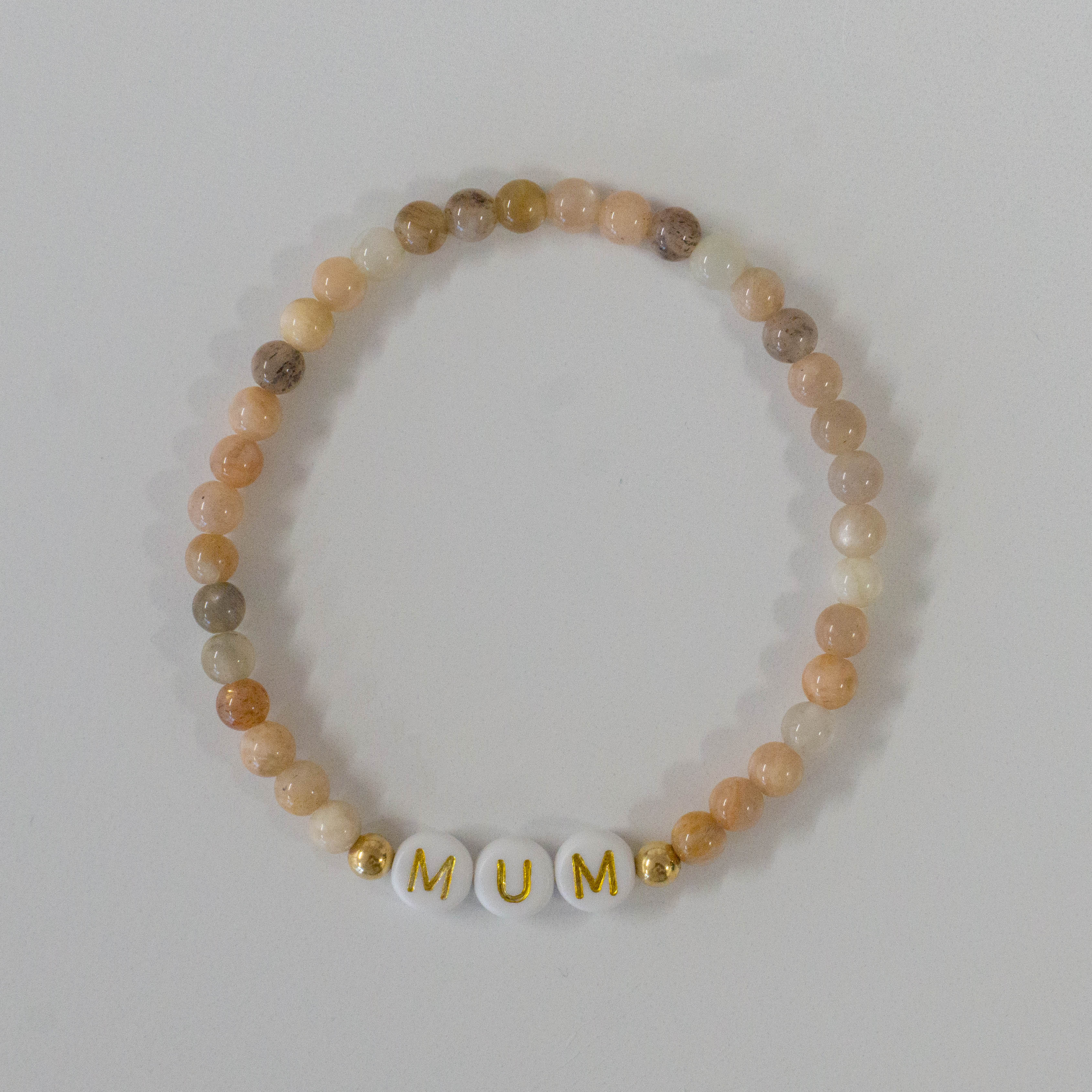 Personalized bracelets, elastic bracelets, beaded bracelet, gold-filled bracelet, dainty bracelet, handmade, essbe, small business, name bracelet, letter bead bracelets, caramel beads