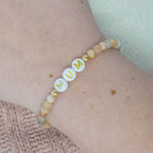 Personalized bracelets, elastic bracelets, beaded bracelet, gold-filled bracelet, dainty bracelet, handmade, essbe, small business, name bracelet, letter bead bracelets, caramel beads